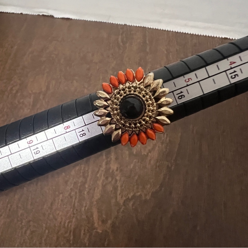 Flower shaped fashion ring used on coop & cami gold tone black coral accents
